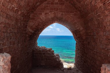 Picturesque ruins of the medieval citadel of Arsuf and the Crusader Fortress. Apollonia Park, Israel. Mediterranean coast. 