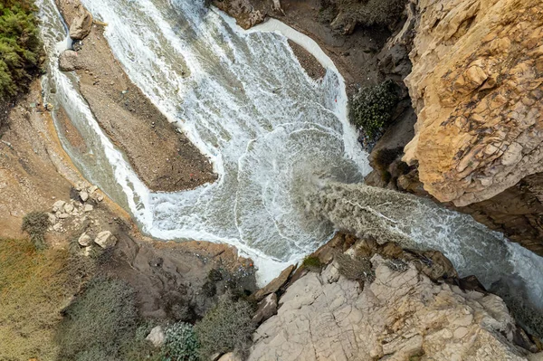 Winter flood on the Kidron stream. Cold rainy winter in Israel. The famous biblical stream Kidron. Ancient mountains around the Dead Sea. The waterfall were photographed by a drone. 