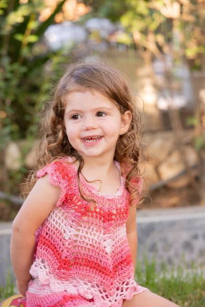 Charming Little Girl Curly Hair Plays Green Grassy Lawn Warm — Fotografia de Stock