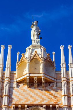 The magnificent facade of the Doge's Palace. Doge's Palace is a great monument of Italian Gothic architecture. Huge Themis Statue. Magical journey to Venice. The concept of photo tourism
