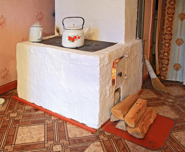 Brick stove in rural wooden house — Stock Image Brick stove in rural wooden house Royalty Free Stock Photos