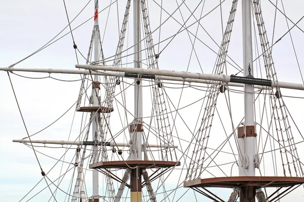 Ship masts on cloudy background — Stock Photo, Image