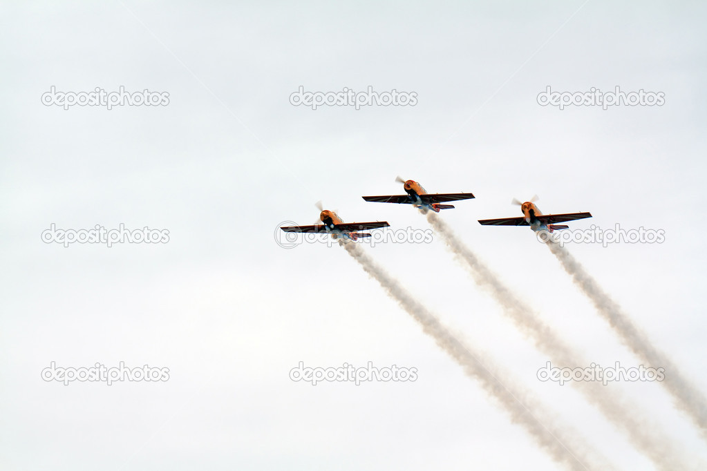 three planes in cloudy sky