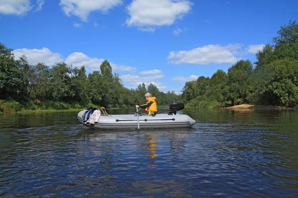 Two boys on rubber boat on river — Stock Photo, Image