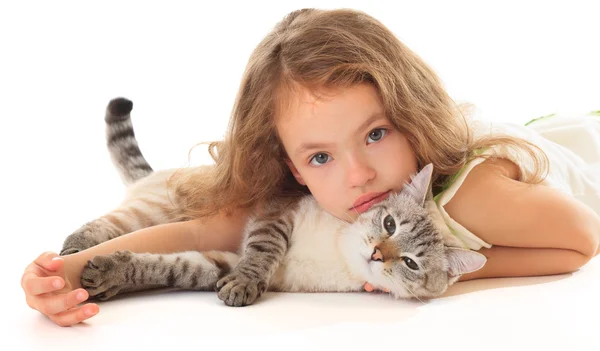 Beautiful little girl hugging her cat. — Stock Photo, Image