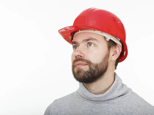 Ouvrier de la construction dans un casque rouge . — Photo