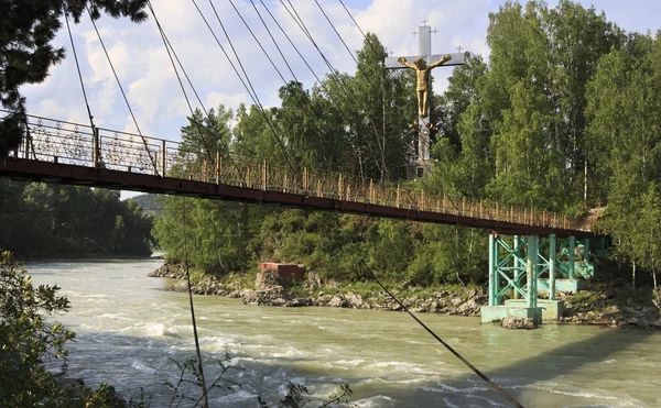 Suspension Bridge and cross with a crucifix on the island of the — Stock Photo, Image