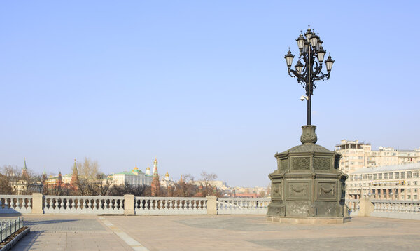 Ancient lantern on the background of the Moscow Kremlin.