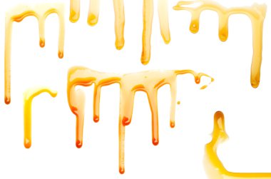 Caramel syrup on white background clipart