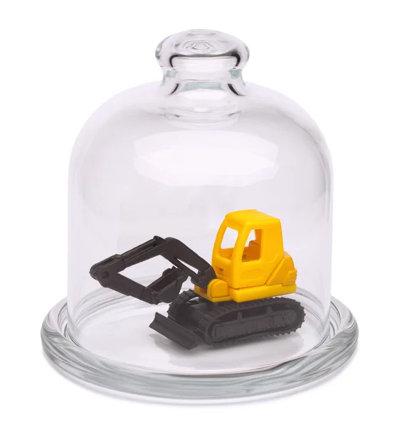 Zabawka żółty koparka w szklaną kopułą — Zdjęcie stockowe
