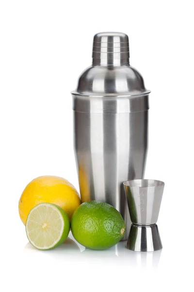 Cocktail shaker with measuring cup and citruses — Stock Photo, Image