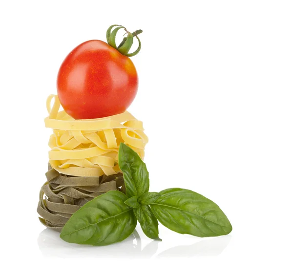 Fettuccine nest pasta with tomato cherry and basil — Stock Photo, Image