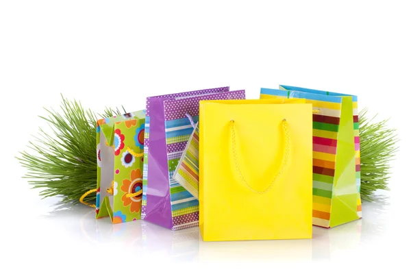 Colorful gift bags with christmas gifts — Stock Photo, Image