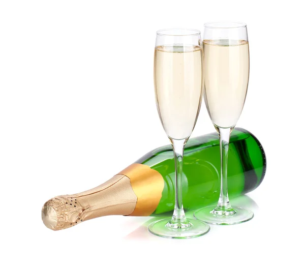 Lying champagne bottle and two glasses — Stock Photo, Image