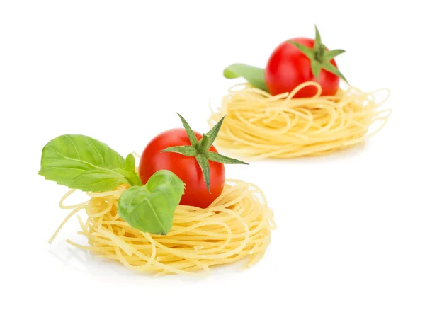 Cherry tomatoes, basil and pasta — Stock Photo, Image