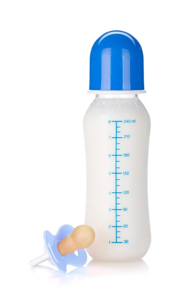 Baby bottle and pacifier for boy — Stock Photo, Image