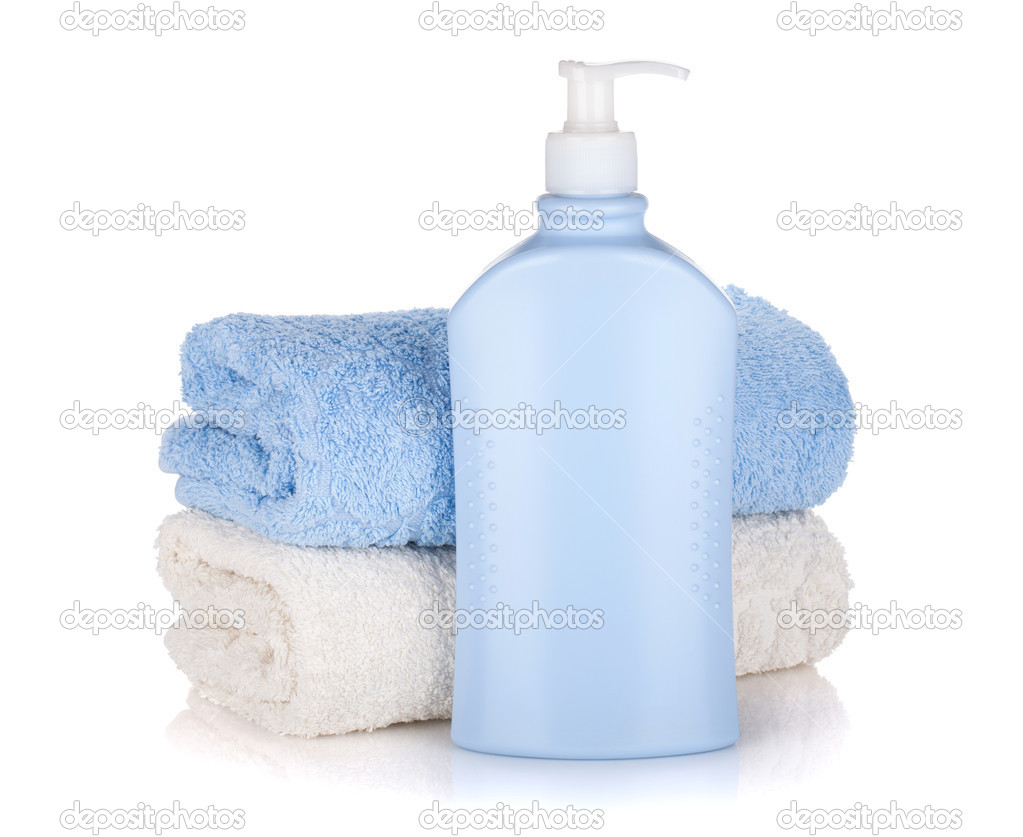 Shampoo bottle and towels