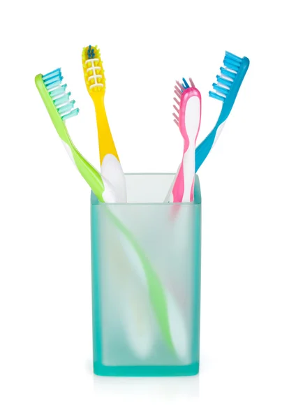Quatro escovas de dentes multicoloridas — Fotografia de Stock