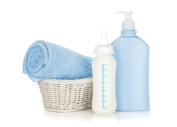 Baby milk bottle, shampoo and towel — Stock Photo, Image