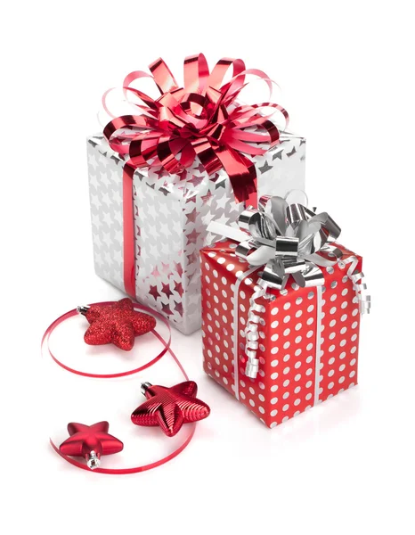 Two red and silver gift boxes with ribbons and christmas decor — Stock Photo, Image