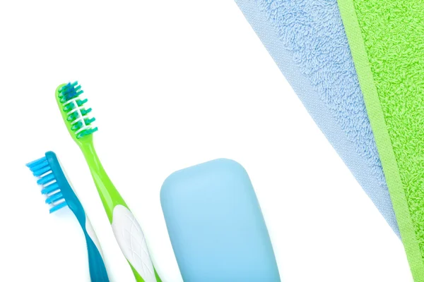 Toothbrushes, soap and towels — Stock Photo, Image