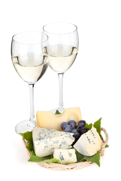 Cheese, grape and two white wine glasses — Stock Photo, Image