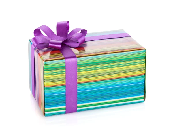 Färgglada presentförpackning med band och rosett — Stockfoto