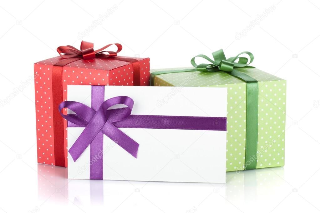 Colorful gift boxes and letter with ribbon and bow