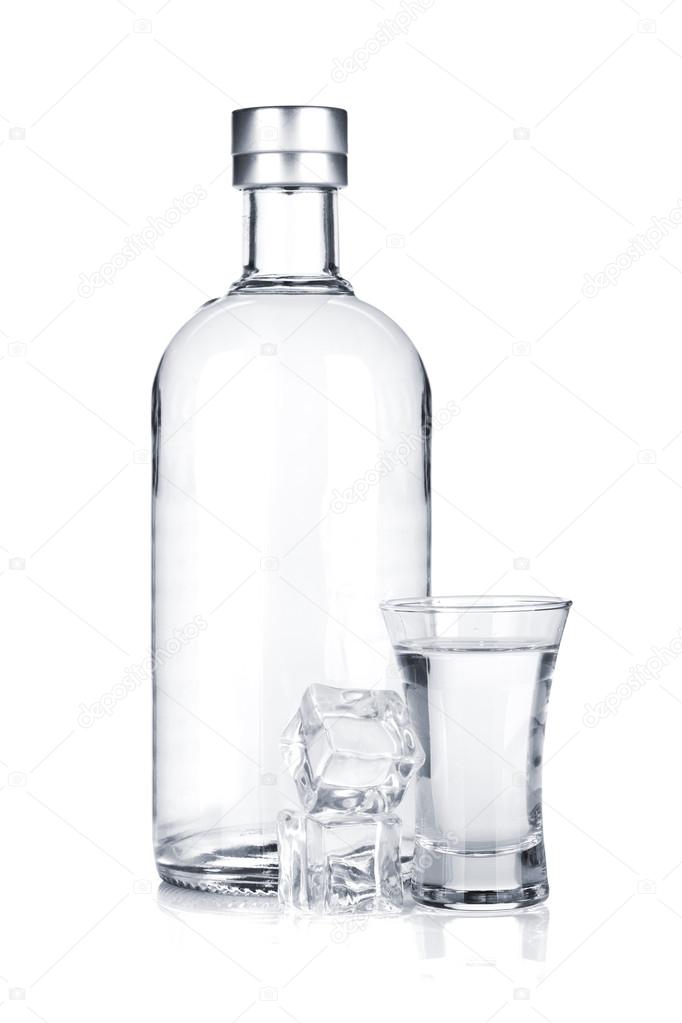 Bottle of vodka and shot glass with ice