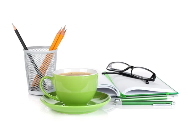 Green coffee cup, glasses and office supplies — Stock Photo, Image