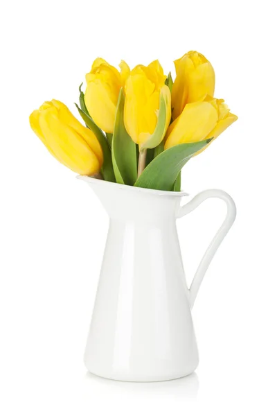 Yellow tulips in a jug — Stock Photo, Image