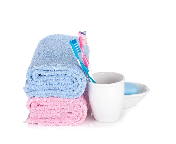 Toothbrushes, soap and two towels — Stock Photo, Image