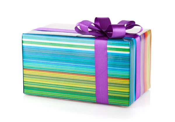 Färgglada presentförpackning med band och rosett — Stockfoto