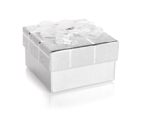 Silver gift box with bow and heart label — Stock Photo, Image