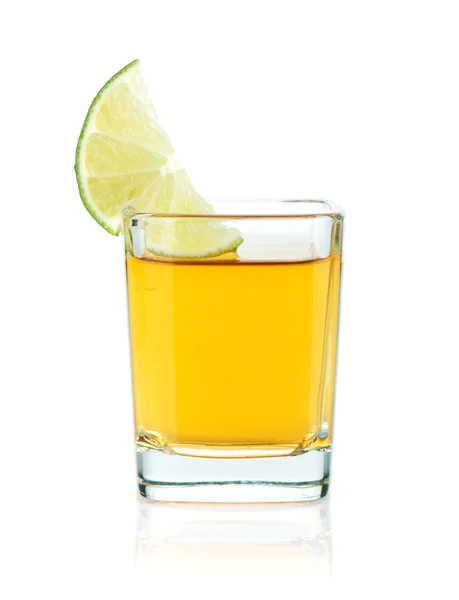 Shot of gold tequila with lime slice — Stock Photo, Image