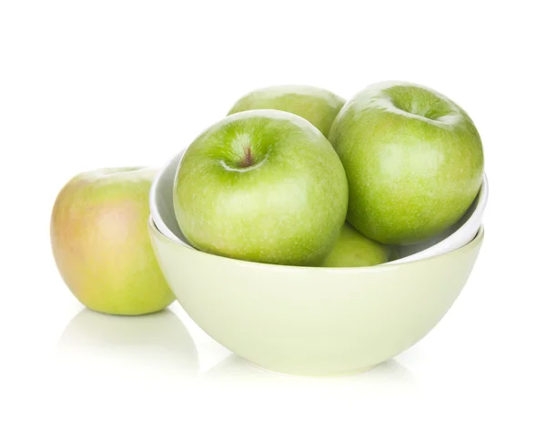 Green apples in fruit bowl — Stock Photo, Image