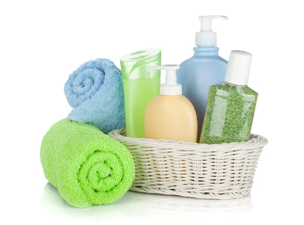 Cosmetics bottles and towels — Stock Photo, Image