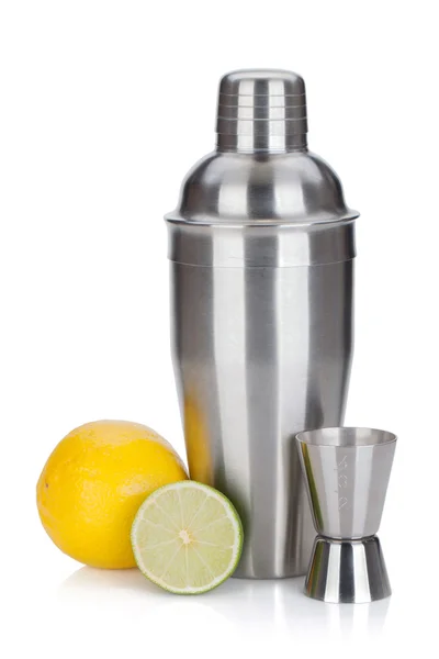Cocktail shaker with measuring cup and citruses — Stock Photo, Image