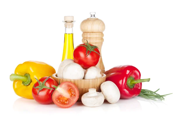 Fresh vegetables and mushrooms with olive oil and pepper shaker — Stock Photo, Image