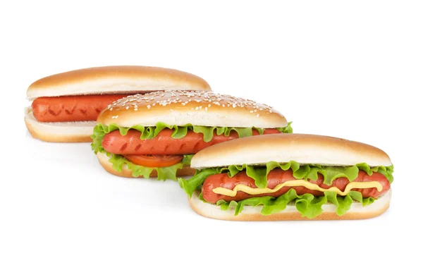 Three hot dogs with various ingredients — Stock Photo, Image