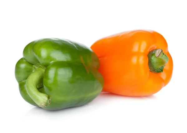 Oranžové a zelené papriky — Stock fotografie