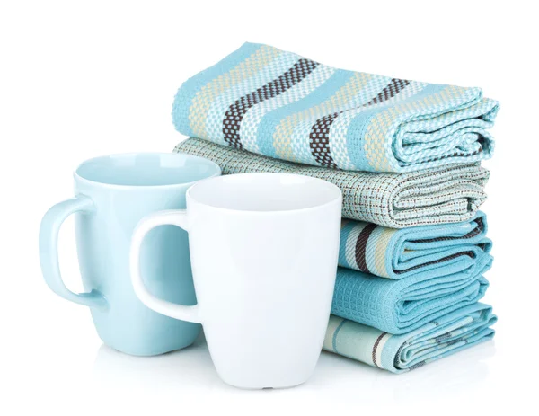 Kitchen towels and tea cups — Stock Photo, Image
