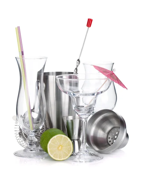 Cocktail shakers, glasses, utensils and lime — Stock Photo, Image