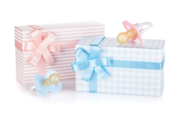 Gift box and pacifier for little boy and girl — Stock Photo, Image