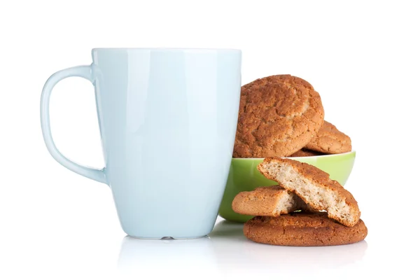 Milk cup and bowl with cookies — Stock Photo, Image