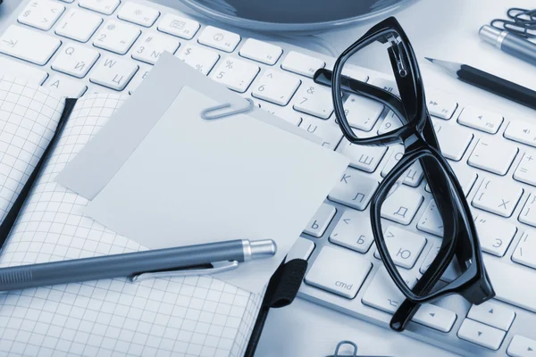 Office supplies and computed keyboard closeup — Stock Photo, Image