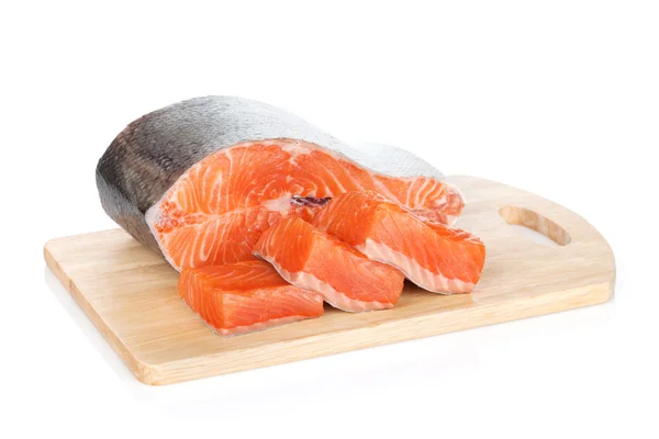 Raw salmon on cutting board — Stock Photo, Image