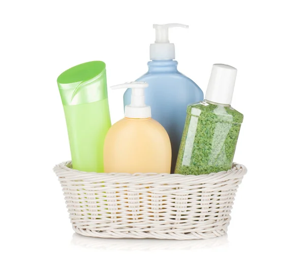 Cosmetics bottles in basket — Stock Photo, Image