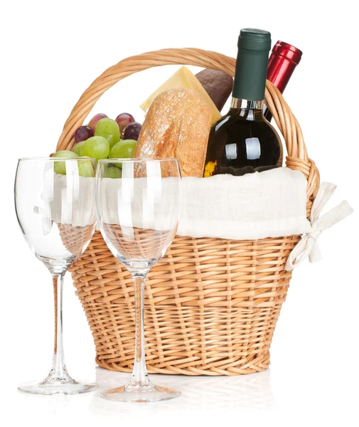 Picnic basket with bread, cheese, grape and wine bottles — Stock Photo, Image