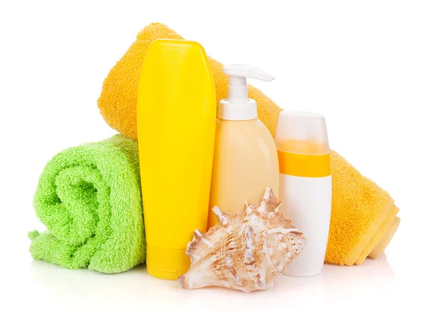 Bath bottles, towel and seashell — Stock Photo, Image